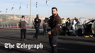 video: Jerusalem shooting: Three dead after gunmen open fire at bus stop