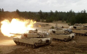 A US Army Abrams tank fires during the Saber Strike military exercises in Adazi military training area, Latvia