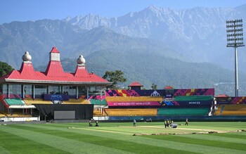 Staff work on the field ahead of the 2023 ICC men's cricket World Cup one-day international (ODI) match between Afghanistan and Bangladesh at the Himachal Pradesh Cricket Association Stadium in Dharamsala on October 6, 2023