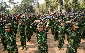 Members of the ethnic rebel group Ta'ang National Liberation Army (TNLA) take part in a training exercise at their base camp in the forest in Myanmar's northern Shan State