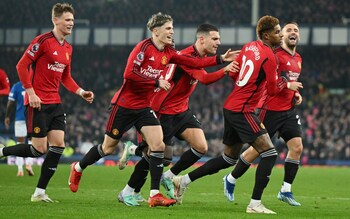 Marcus Rashford of Manchester United celebrates with team-mates after scoring a penalty to make it 2-0 against Everton