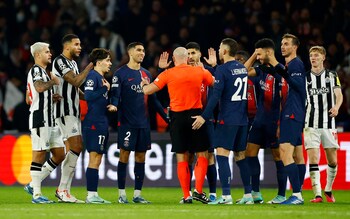 Referee Szymon Marciniak is surrounded by PSG and Newcastle players - Referees striving for perfection is ruining the game – football needs Var less not more