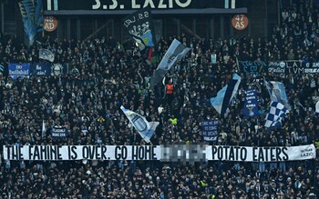 Lazio supporters show a banner during the Uefa Champions League match against Celtic