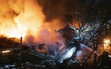 Firefighters battle a blaze after Russian shelling in Pokrovsk, Donetsk